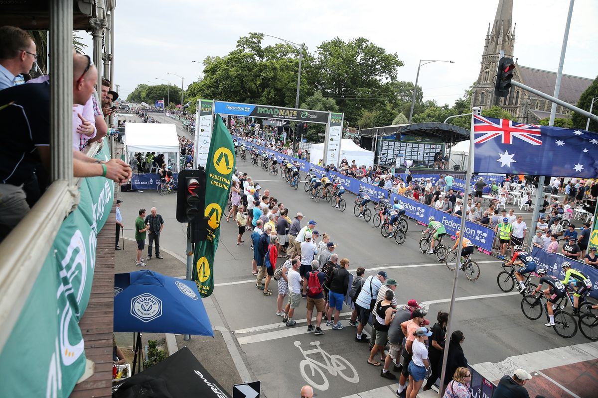 The peloton crosses the line