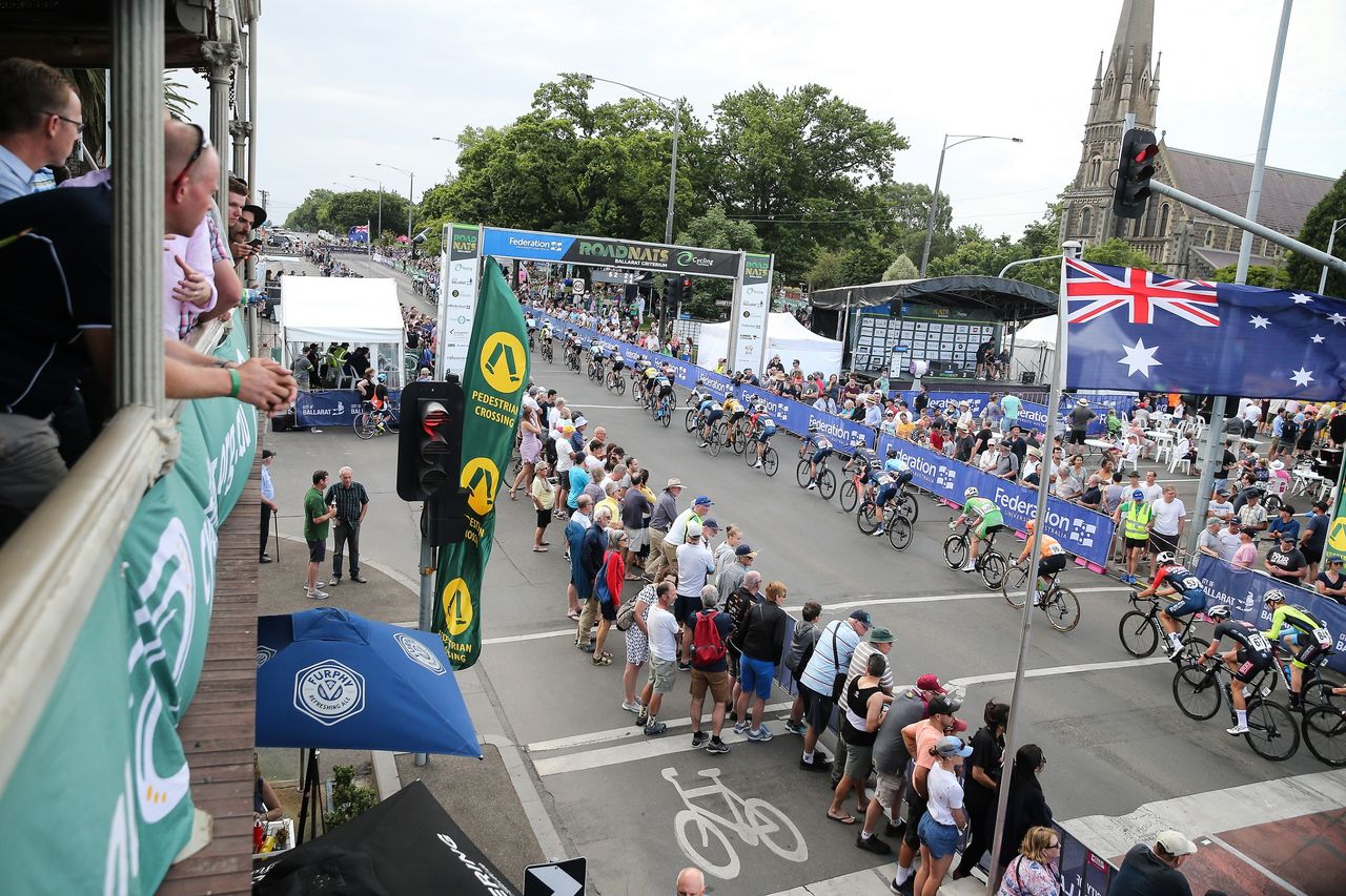 The peloton crosses the line