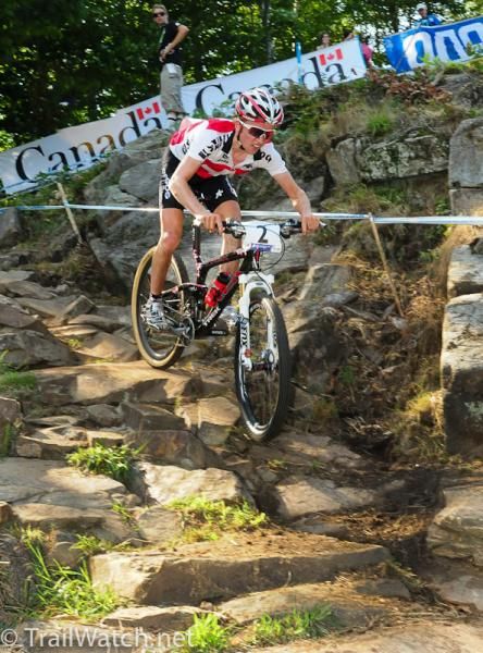 Mathias Fluckiger (Switzerland) rides in second position down a very rocky descent