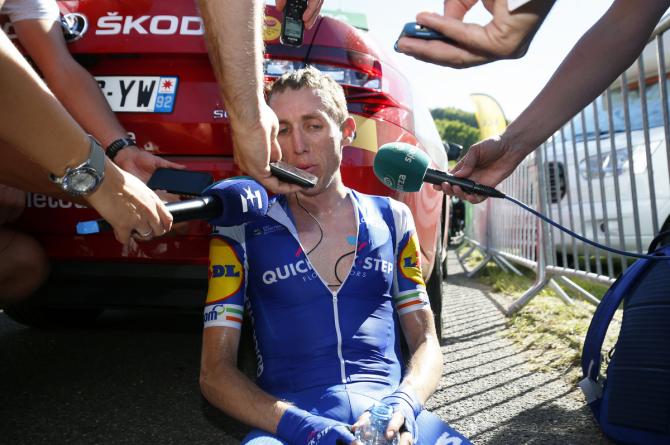 Plenty of microphones to catch the post-stage comments from Dan Martin (Quick-Step Floors)