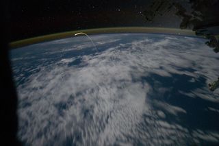 A member of the Expedition 28 crew aboard the International Space Station caught this spectacular photo of a lifetime, showing space shuttle Atlantis actually hurtling through the Earth's atmosphere on its way back to Kennedy Space Center, Florida, July 21, 2011.