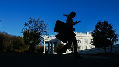 A woman walks into the White House on Nov. 5, 2024.