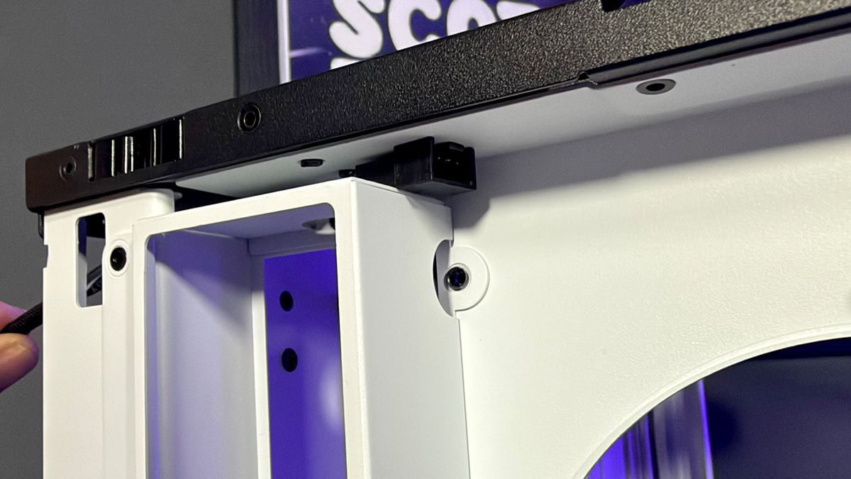 The Havn HS 360 PC case in black and white on a desk.