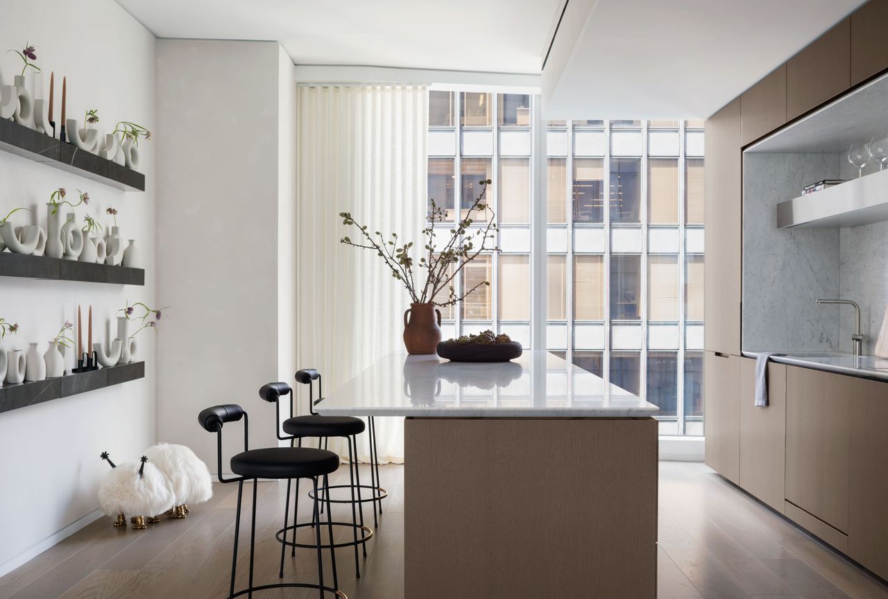 A kitchen with cushioned seats and sleek frame