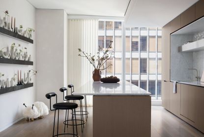 A kitchen with cushioned seats and sleek frame
