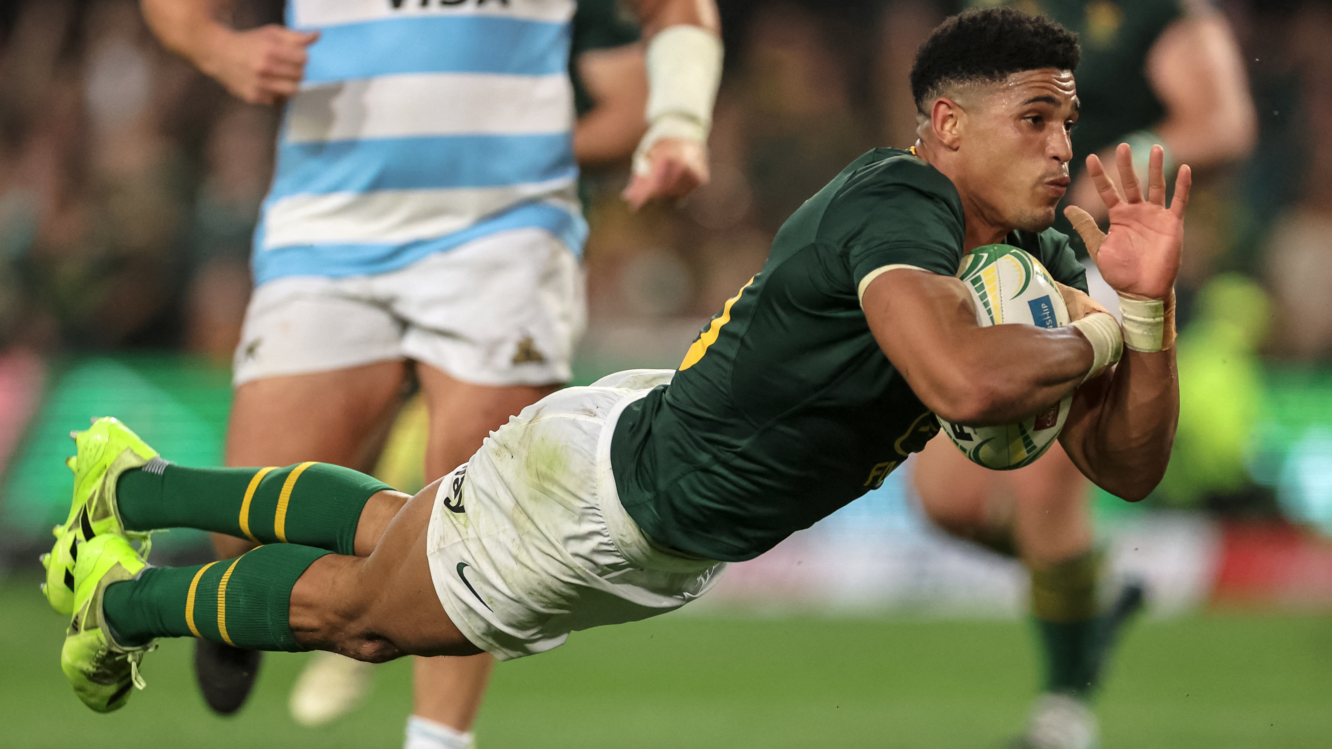 South Africa's fly-half Sacha Feinberg-Mngomezulu dives to score a try during the Rugby Championship Test match between South Africa and Argentina at Kings Park Stadium in Durban on September 27, 2025. 