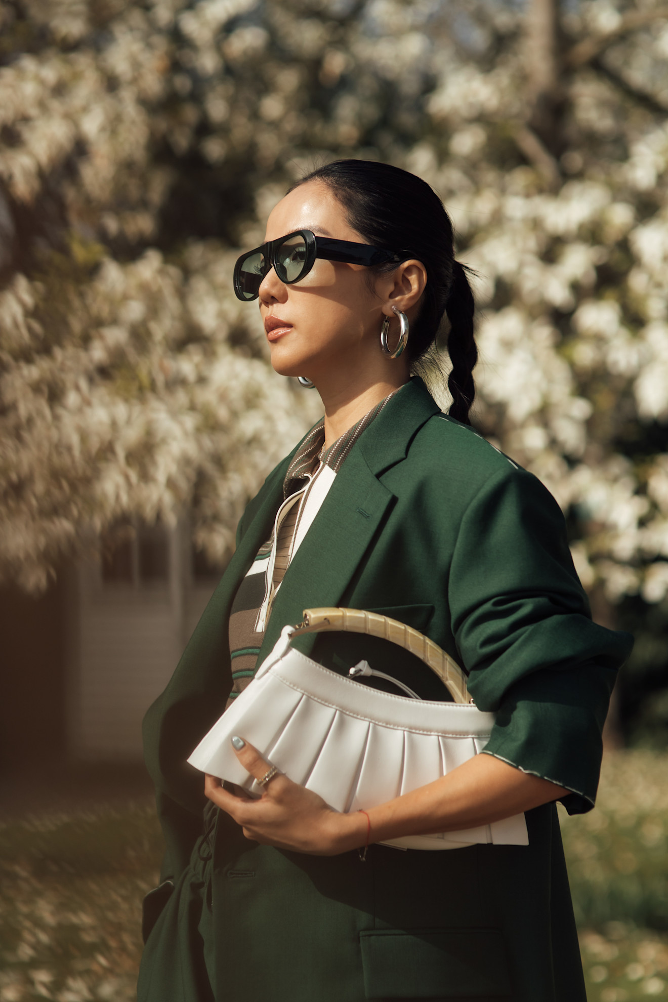 A woman wearing a plaited ponytail at Paris Fashion Week AW26