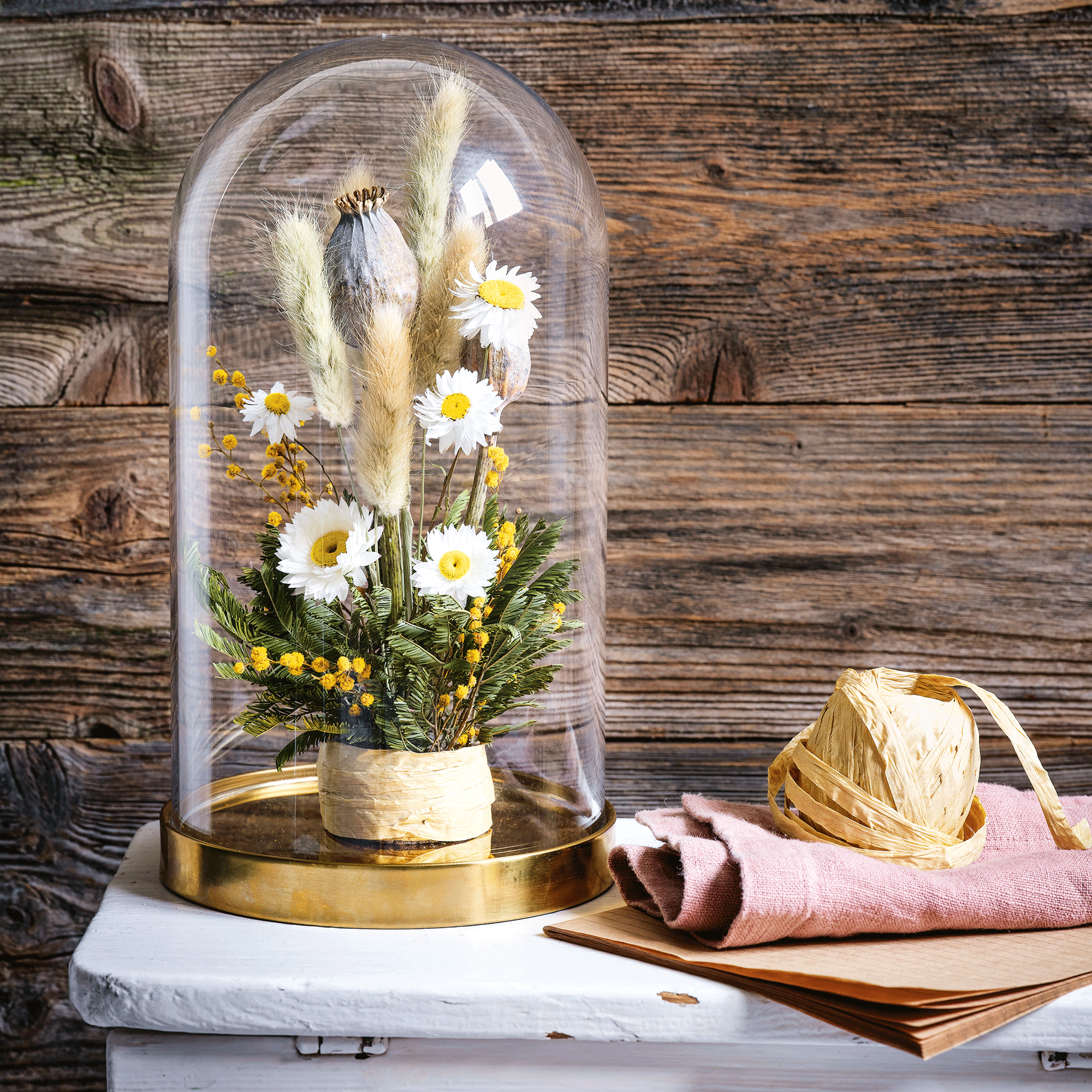 Dried flowers under a cloche