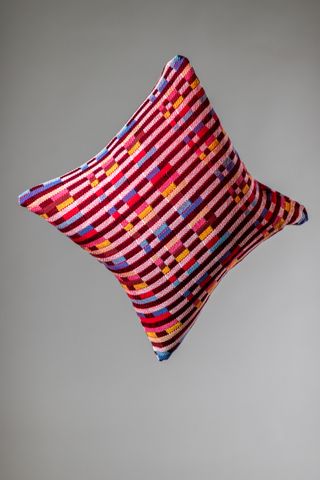 Square pillow with checkered motif in multiple colours