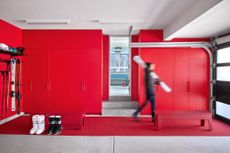 A bright red garage interior used for ski storage in Aspen, Colorado