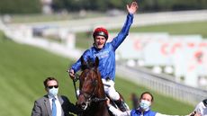 Jockey Adam Kirby celebrates after winning the Cazoo Derby 2021 riding Adayar.