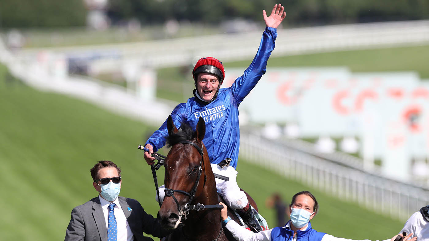 Jockey Adam Kirby celebrates after winning the Cazoo Derby 2021 riding Adayar.