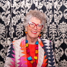 Prue Leith in colourful geometric suit at Camebridge University.