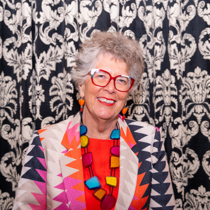 Prue Leith in colourful geometric suit at Camebridge University.
