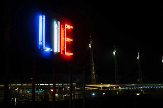 Stefan Brüggemann’s double-sided neon installation ’Truth / Lie’, installed on the roof of The Tunnel House in Tijuana, Mexico, overlooking the US/Mexico border.