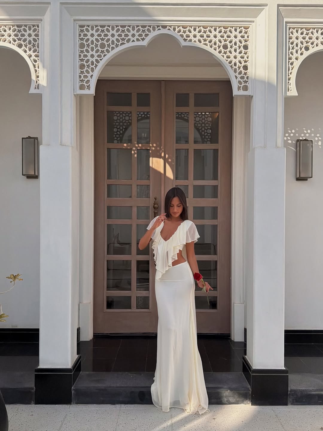 Alexander Leclerc wearing a white skirt set in mid-February 2026