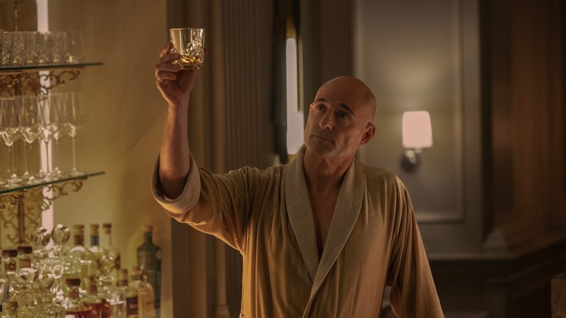 Mark Strong raising a glass in Nine Perfect Strangers