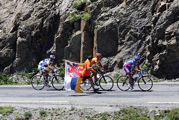 Mickael Rasmussen (Rabobank) gets some support from a fan early on the Galibier.