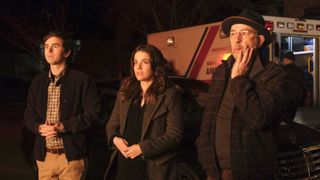 Freddie Highmore, Paige Spara and Richard Schiff stand in front of a burning building in The Good Doctor