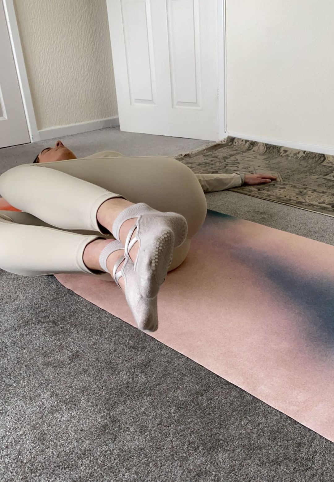 Health writer Katie Sims trying Pilates the spine twist supine every day