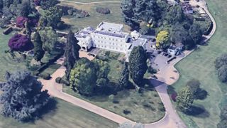 The Royal Lodge in Windsor is a white mansion with trees and large surrounding gardens