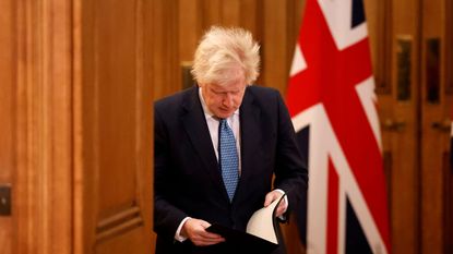 Boris Johnson attends a virtual press conference inside 10 Downing Street 