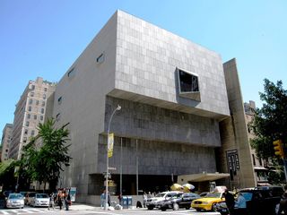 The iconic Marcel Breuer building sports a cutaway front in a street of traditional New York brownstones