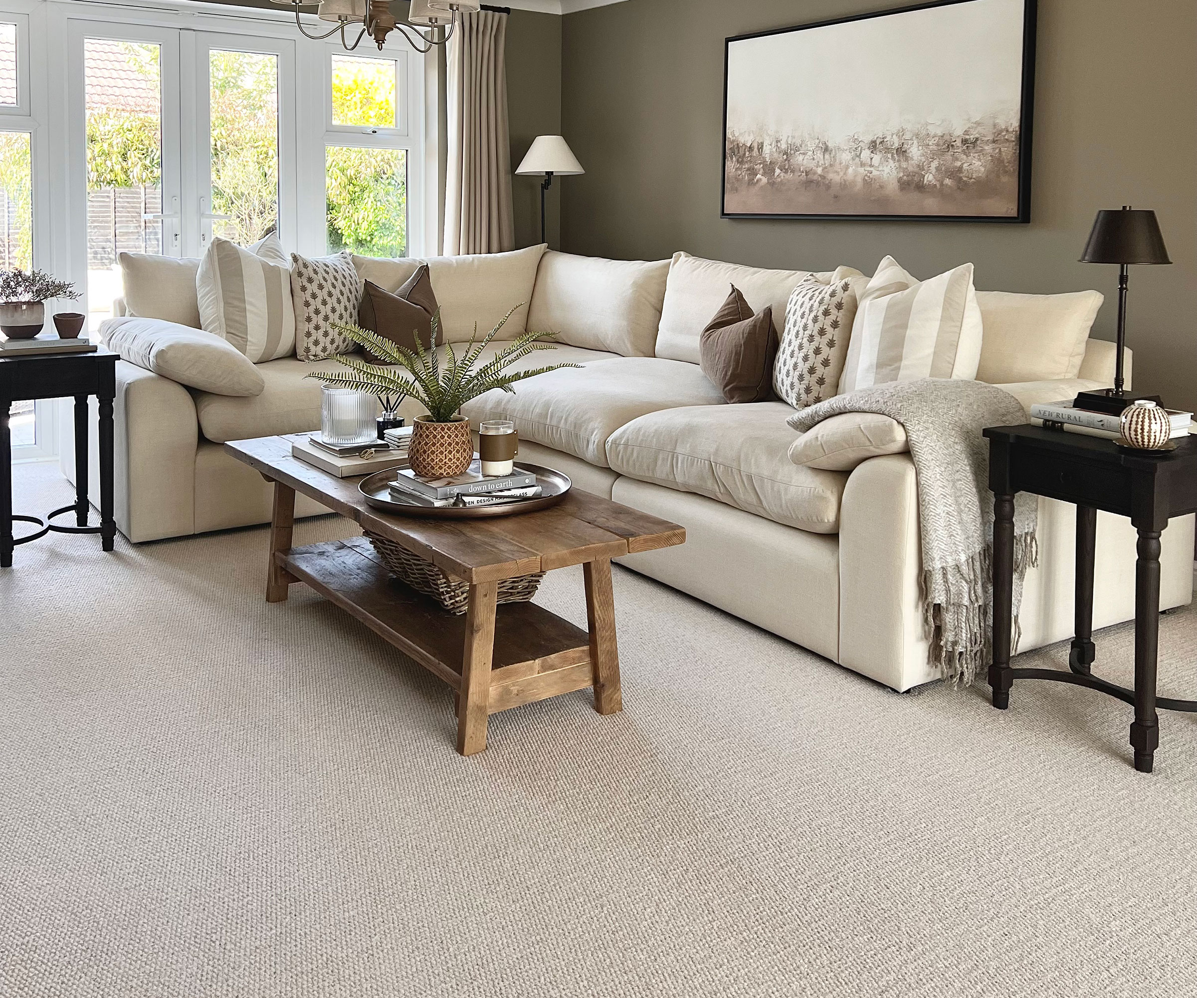 living room with cream carpet