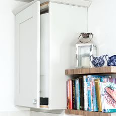 white boiler in whit kitchen cupboard
