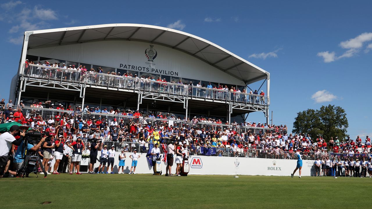 A player hits their 1st tee shot at a packed Solheim Cup 1st tee