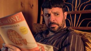 Simon Bird, as David, reads in bed in "Everybody Else Burns" season 2