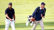 Tiger Woods and caddie Lance Bennett during a practice round ahead of the 2024 Genesis Invitational