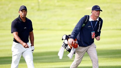 Tiger Woods and caddie Lance Bennett during a practice round ahead of the 2024 Genesis Invitational