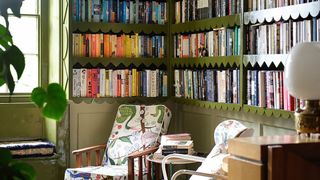 Green bookshelves with scalloped edges