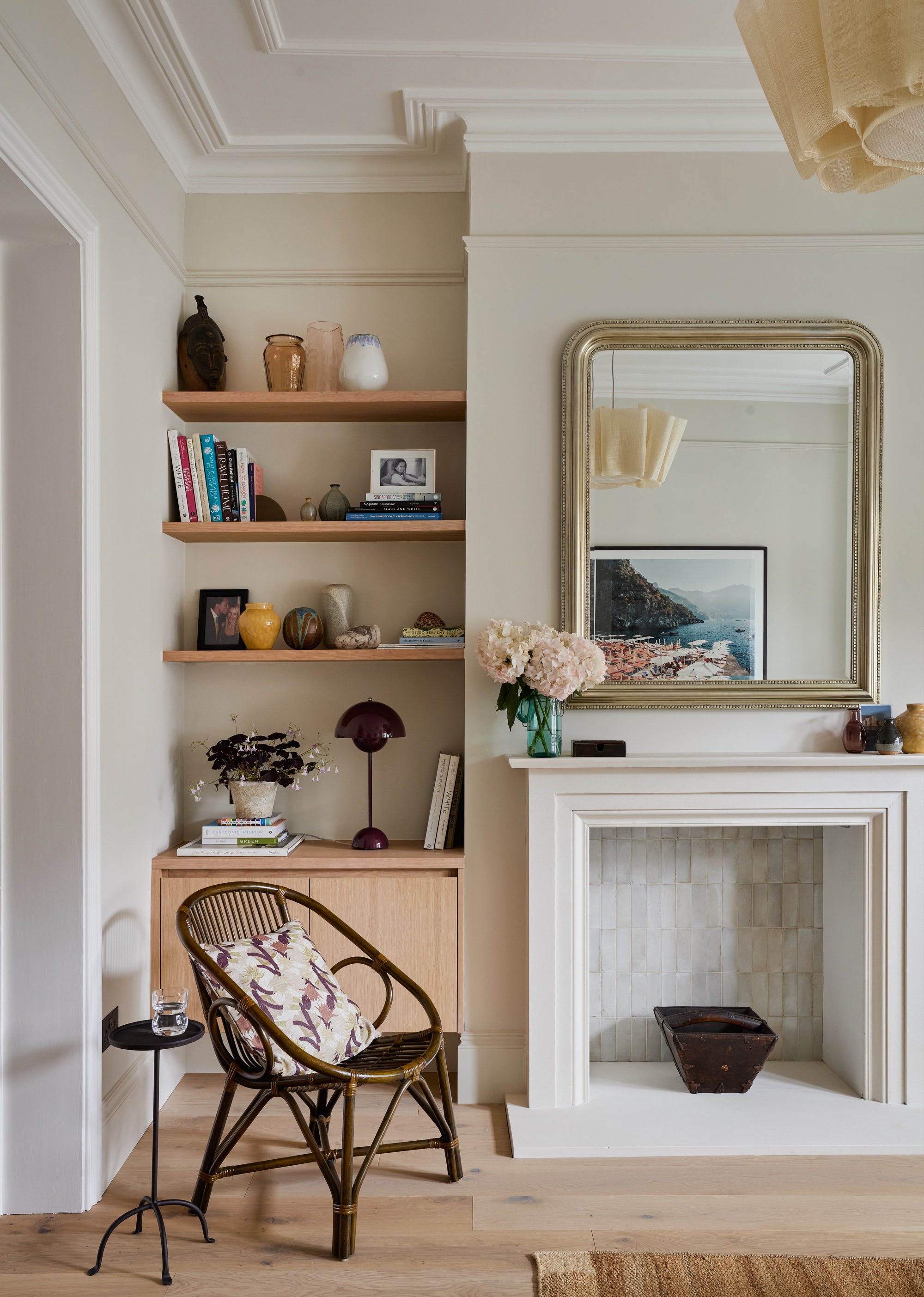living room with vintage chair, quality millwork and open shelving