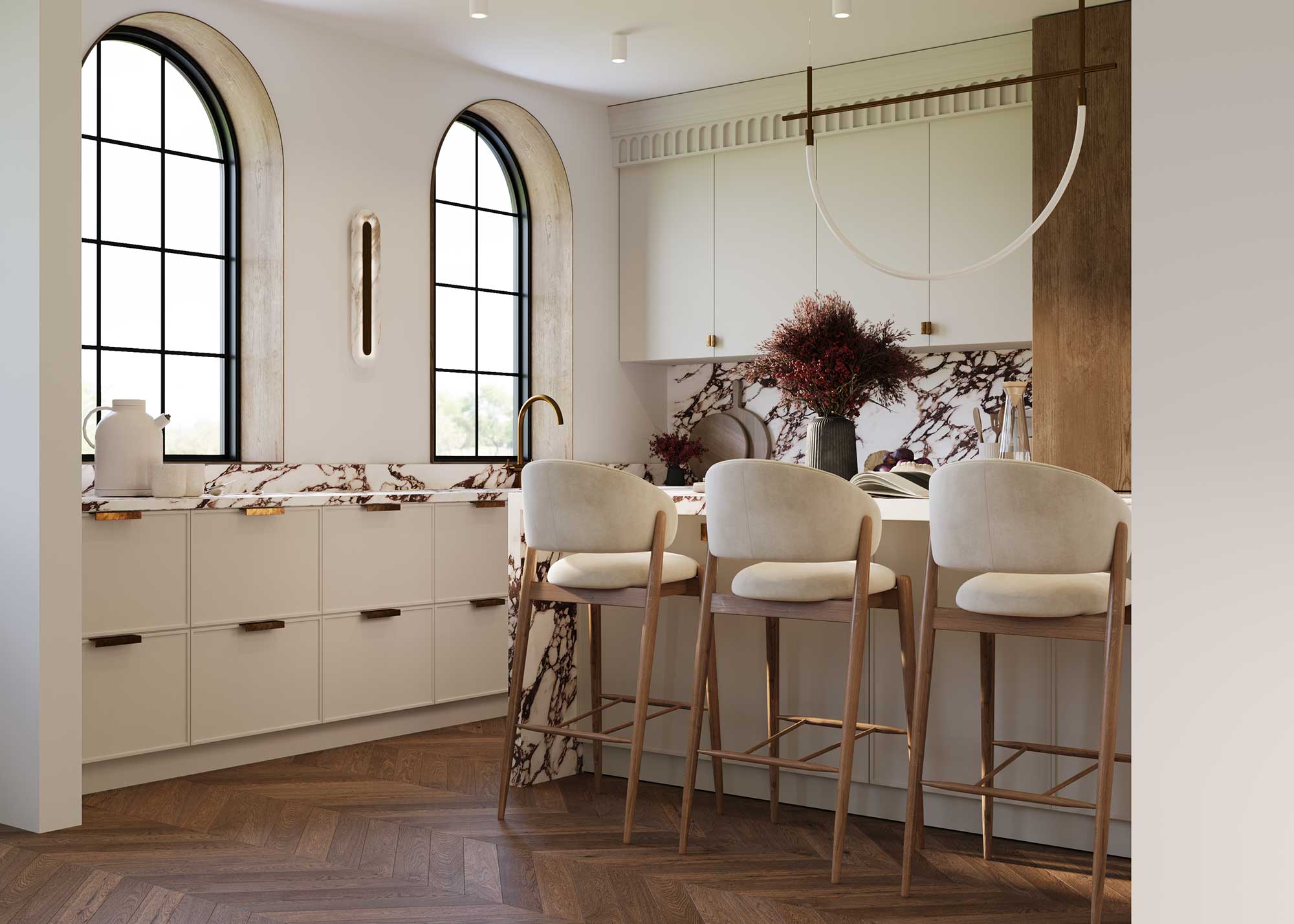 white kitchen with marble island and splashbacks and wooden herringbone flooring and brass cabinet hardware