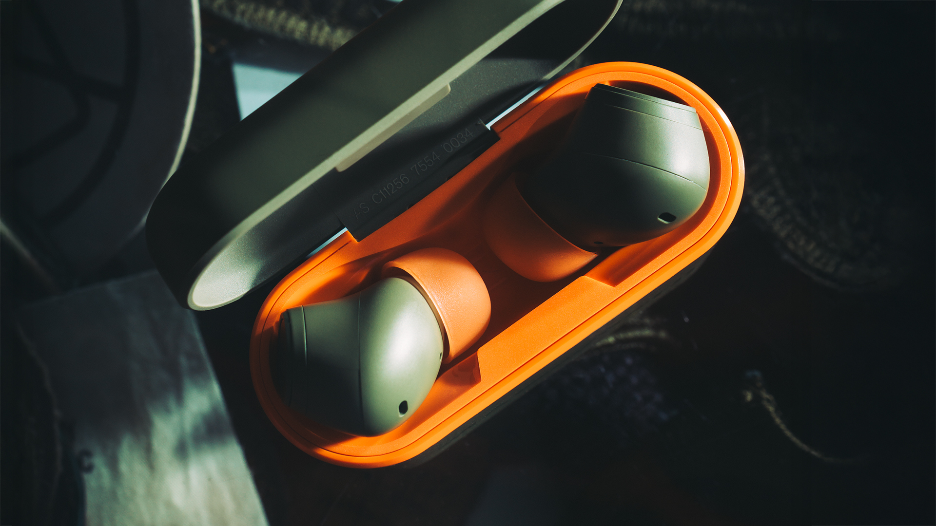 Cambridge Audio Maharishi Melomania A100 earbuds in lifestyle shot