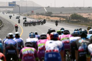 AL MARJAN UNITED ARAB EMIRATES FEBRUARY 24 A general view of the peloton passing through higway while echelons are created due crosswind during the 4th UAE Tour 2022 Stage 5 a 182km stage from Ras al Khaimah Corniche to Al Marjan Island UAETour WorldTour on February 24 2022 in Al Marjan United Arab Emirates Photo by Tim de WaeleGetty Images