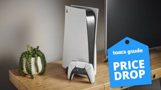 A PS5 console on a table with a Tom's Guide deal tag
