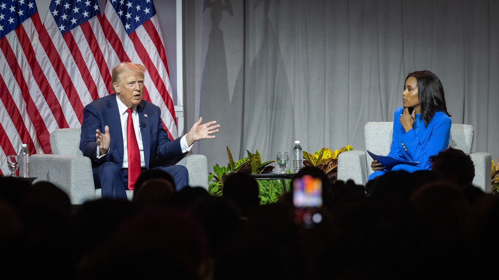  Trump questions Harris' race, clashes with journalists  