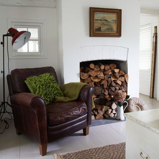 brown leather armchair and chimney breast