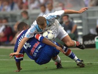 Marseille's Florian Maurice (right) is tackled by Montpellier's Franck Silvestre in a Ligue 1 game in August 1998.