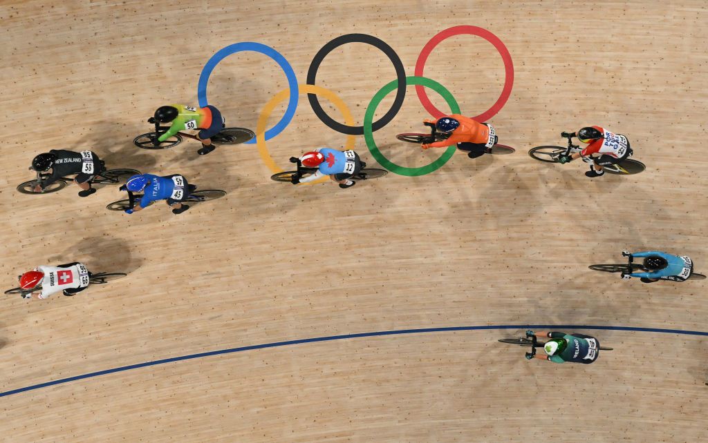 An overview shows riders competing in the women's track cycling omnium tempo race of the Paris 2024 Olympic Games at the Saint-Quentin-en-Yvelines National Velodrome in Montigny-le-Bretonneux, south-west of Paris, on August 11, 2024. (Photo by John MACDOUGALL / AFP)