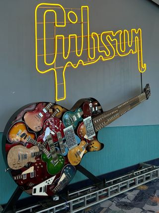 A Gibson folk art guitar of sorts, pictured at the company's booth at the 2025 NAMM Show in Anaheim, California