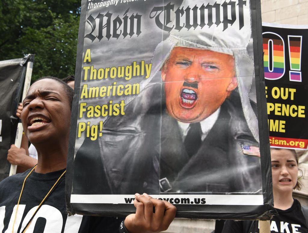 An American protester beats Kim Jong Un to the punch