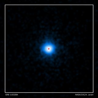 NASA's Chandra X-ray Observatory completed this four-hour exposure of GRB 110328A on April 4. The center of the X-ray source corresponds to the very center of the host galaxy imaged by Hubble (red cross).