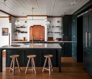 a kitchen with a tile tin ceiling