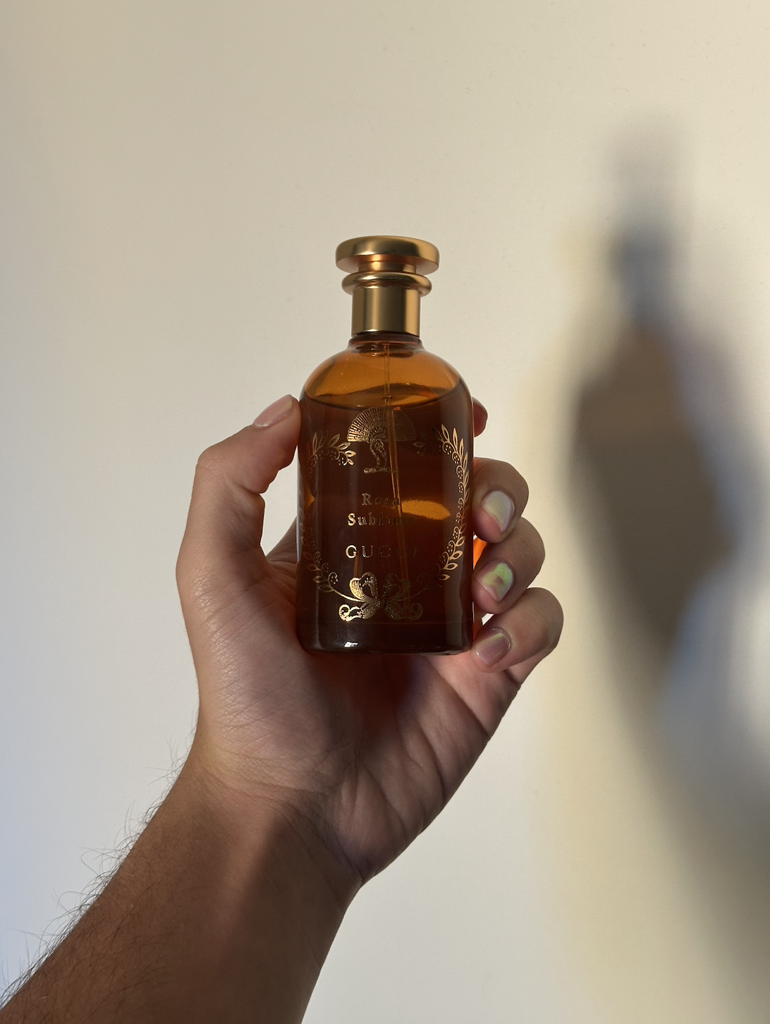 David Evan Ruff holding Gucci Rosa Sublime