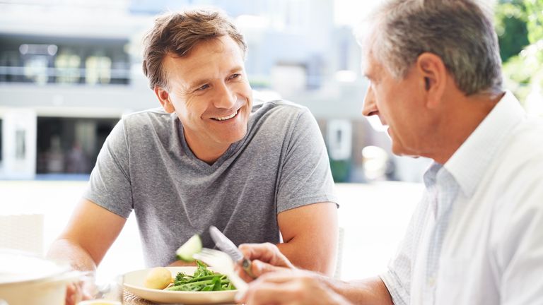 Man looks happy as he eats a healthy meal