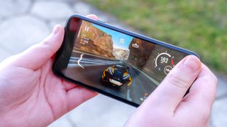 iPhone SE 2022 playing racing game